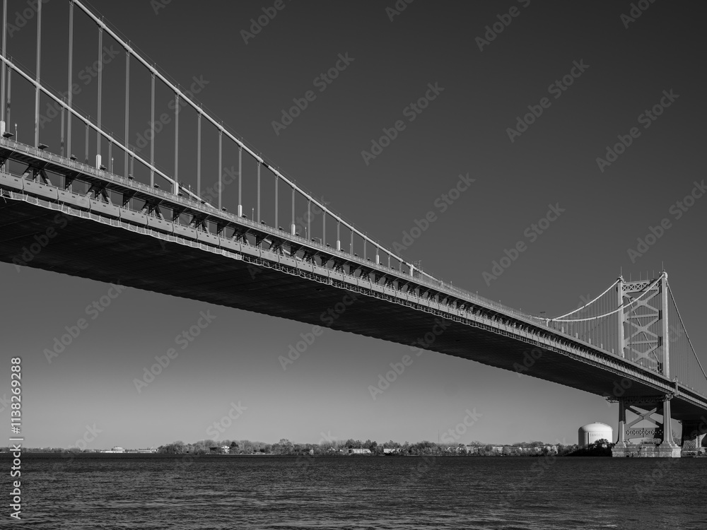 The Ben Franklin Bridge built in 1926 spanning between Philadelphia PA and Camden New Jersey on a beautiful blue sky afternoon The Ben Franklin Bridge built in 1926 spanning between Philadelphia PA and Camden New Jersey on a beautiful blue sky afternoon