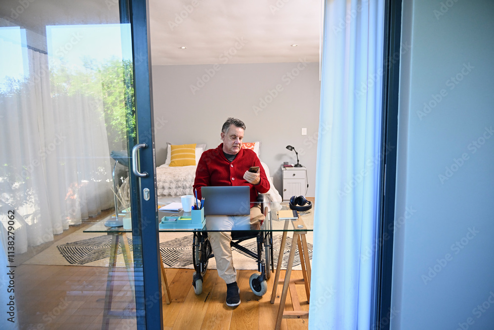Man in wheelchair using smart phone Man in wheelchair using smart phone