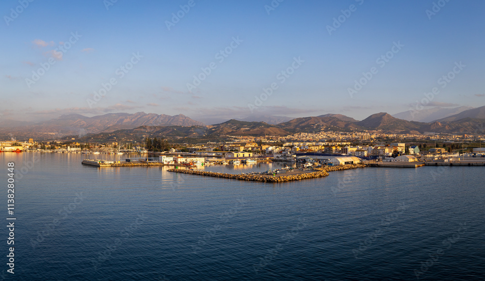 Panoramic photo of Motril, Spain taken from the water looking into town and the distant mountains early in the morning Panoramic photo of Motril, Spain taken from the water looking into town and the distant mountains early in the morning
