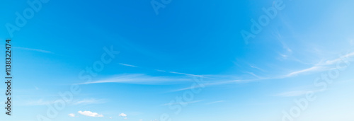 Small white clouds and blue sky photo