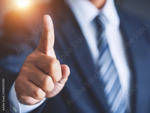 Business executive pointing with finger, emphasizing point confidently