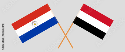 Crossed flags of Republic of Paraguay and Yemen. Official colors. Correct proportion. Vector illustration photo