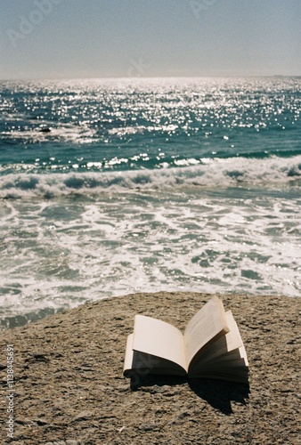 Reading a book with a view on the ocean, lovely aesthetic, shot on film