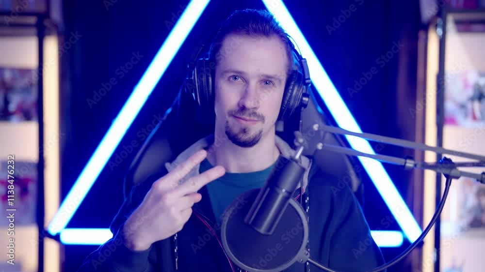 Male gaming streamer greet audience with piece sign 4K Male gaming streamer greet audience with piece sign 4K