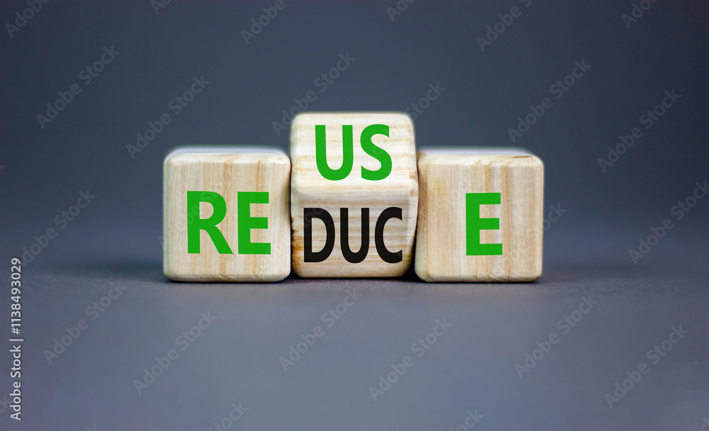 Reuse or reduce symbol. Concept words Reuse Reduce on wooden block. Beautiful grey table grey background. Business reuse or reduce concept. Copy space. Reuse or reduce symbol. Concept words Reuse Reduce on wooden block. Beautiful grey table grey background. Business reuse or reduce concept. Copy space.