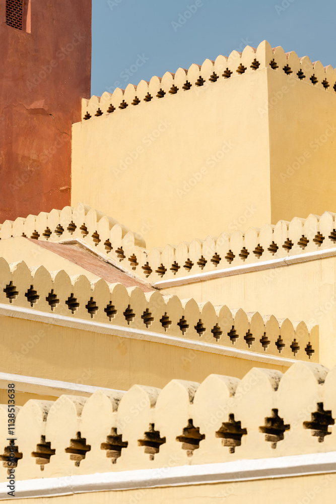 RED AND YELLOW WALL, BLUE HEAVEN OF THE HAWA MAHAL IN JAIPUR INDIA RED AND YELLOW WALL, BLUE HEAVEN OF THE HAWA MAHAL IN JAIPUR INDIA
