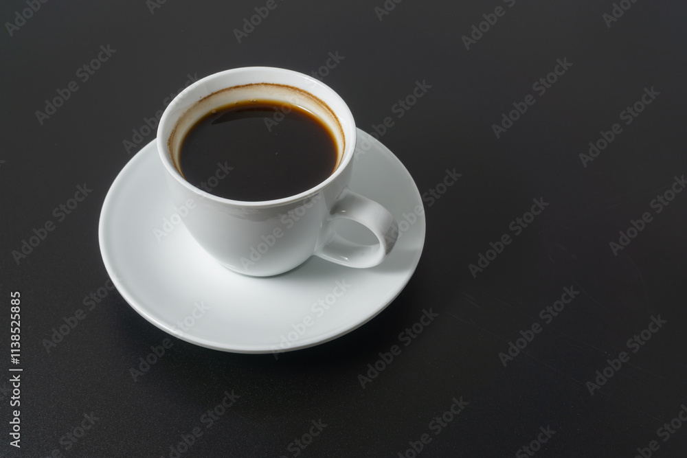 A cup of americano coffee on black background A cup of americano coffee on black background