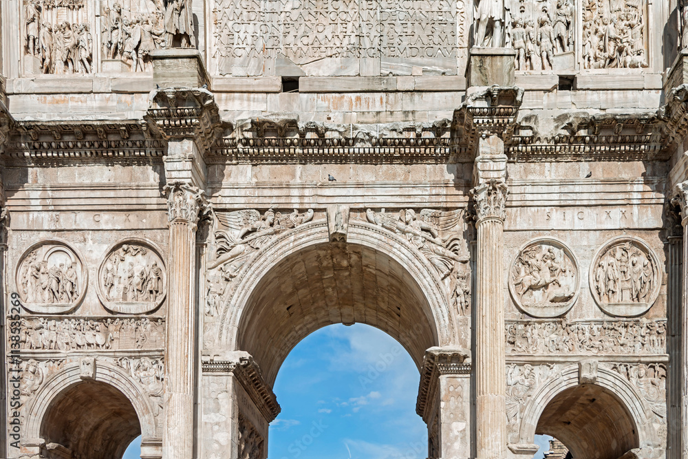 Obraz premium The Arch of Constantine is a triumphal arch, erected by the Roman Senate to commemorate Constantine I's victory over Maxentius at the Battle of Milvian Bridge in 312 AD. Rome, Italy, 2017