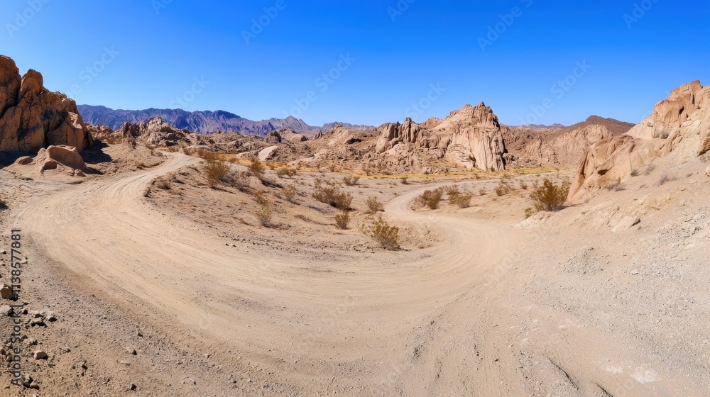 Serene Desert Landscape with Winding Dirt Road and Rocky Formation Views Serene Desert Landscape with Winding Dirt Road and Rocky Formation Views