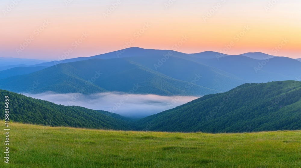 Serene Mountain Landscape at Sunrise with Colorful Sky and Fog Below Serene Mountain Landscape at Sunrise with Colorful Sky and Fog Below