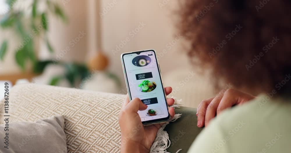 Hands, phone screen and food delivery app in home with choice, scroll and online shopping in lounge. Person, smartphone and e commerce for lunch, order and decision for deal on sofa at apartment Hands, phone screen and food delivery app in home with choice, scroll and online shopping in lounge. Person, smartphone and e commerce for lunch, order and decision for deal on sofa at apartment