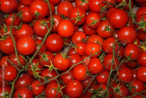 Cherry tomato close-up. Round with bright red skin and glossy surface. A fresh and colorful addition to any healthy lifestyle or culinary presentation.