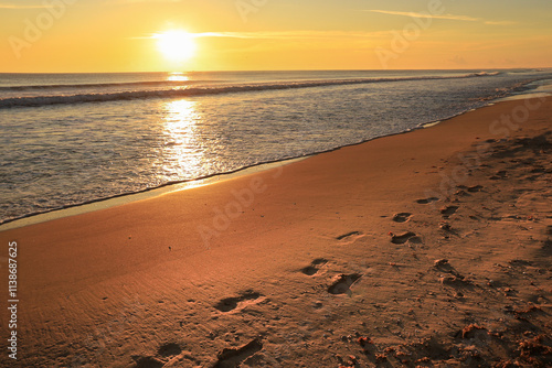 Wallpaper Mural Footprints on the sand on the beach at sunrise in Arenales del Sol, Alicante Torontodigital.ca
