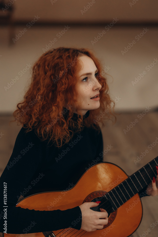 Fototapeta premium portrait of a red-haired woman playing the gatyr