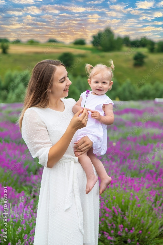 Happy mother and daughter in a lavender field Happy mother and daughter in a lavender field