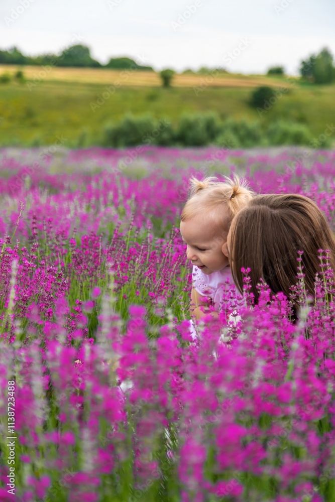 Happy mother and daughter in a lavender field Happy mother and daughter in a lavender field