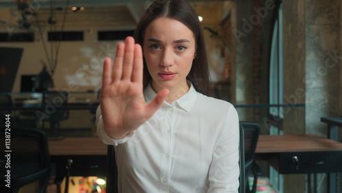 Caucasian business woman serious confident displeased girl student worker employee female businesswoman looking at camera outstretch hand no reject stop gesture arm sign deny warn forbid dissatisfied