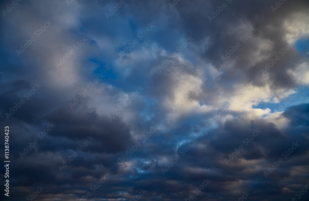 The contrast of a blue sky and gray-white clouds on a winter day. The contrast of a blue sky and gray-white clouds on a winter day.