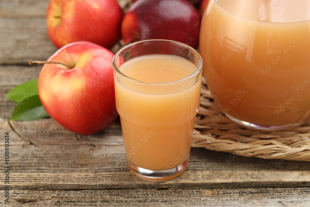 Tasty apple juice and fresh fruits on wooden table, closeup Tasty apple juice and fresh fruits on wooden table, closeup