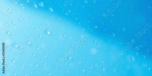 Water droplets glisten on a vibrant blue background, reflecting light and creating a refreshing and calming image, vibrant, refreshing