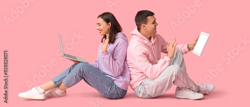 Young couple with laptop an...