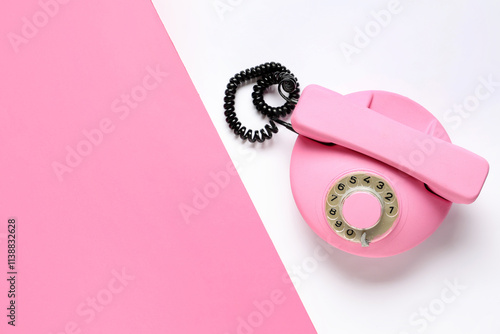 Pink retro telephone on col...