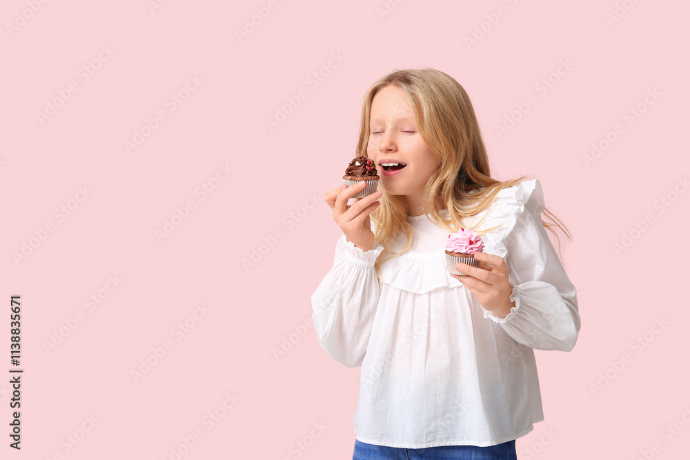 Cute little girl eating sweet cupcakes on color background Cute little girl eating sweet cupcakes on color background