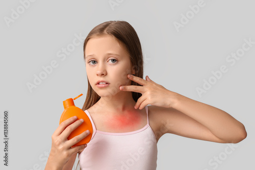 Sad little girl with red su...