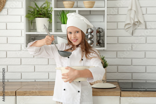 Cute little happy chef with...