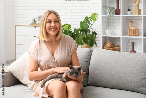 Middle-aged woman petting c...