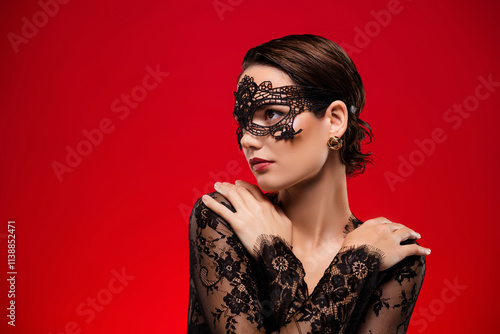 Photo of gorgeous lady wear black clothes hug herself look empty space isolated on red color background