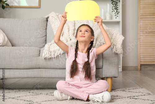 Thoughtful little girl with...