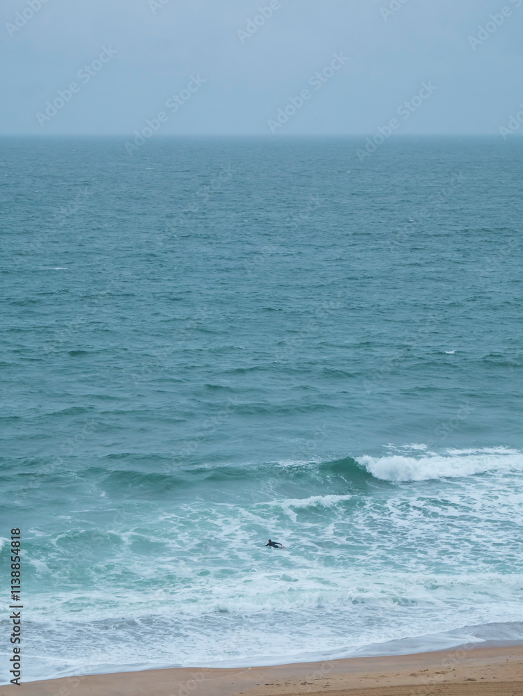 Biarritz coastline with beach blue sea and overcast rainy weather Biarritz coastline with beach blue sea and overcast rainy weather