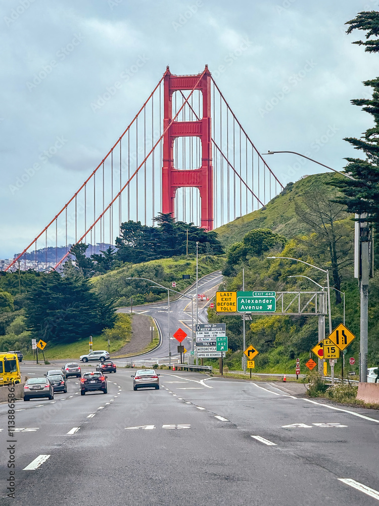 Scenic view of Golden Gate Bridge, San Francisco, California, USA from the street against cloudy sky