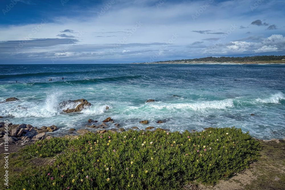 Scenic view of Pacific Ocean coastline seen from Spanish Bay Vista Point, Del Monte Forest, California, USA against blue sky with clouds