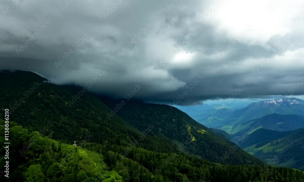 Lush green mountains under a cloudy sky, showcasing natural beauty. Lush green mountains under a cloudy sky, showcasing natural beauty.