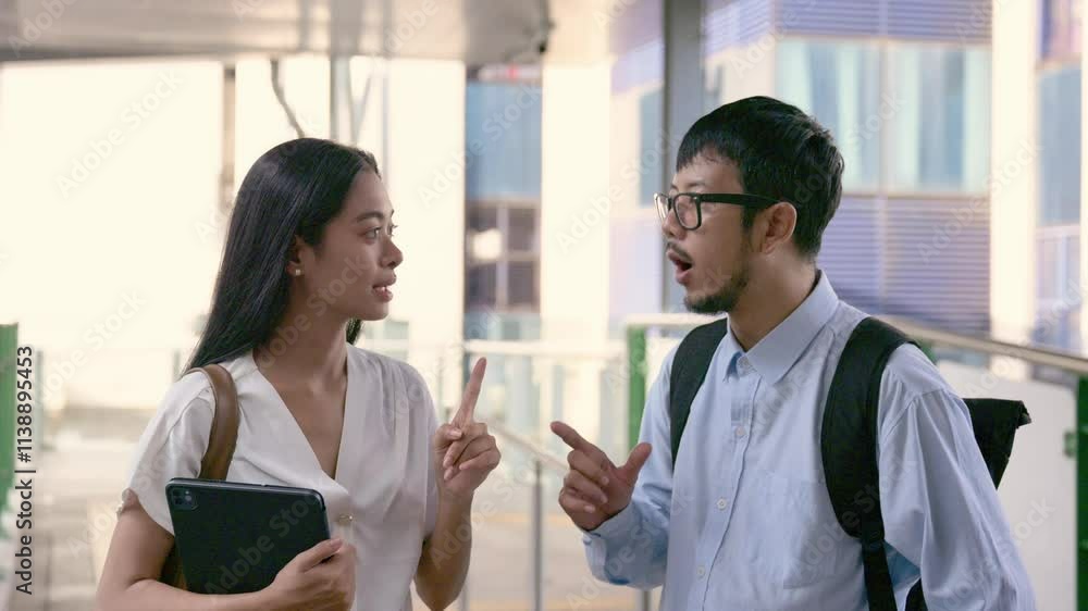 Young asian professionals having a heated discussion in Bangkok Young asian professionals having a heated discussion in Bangkok
