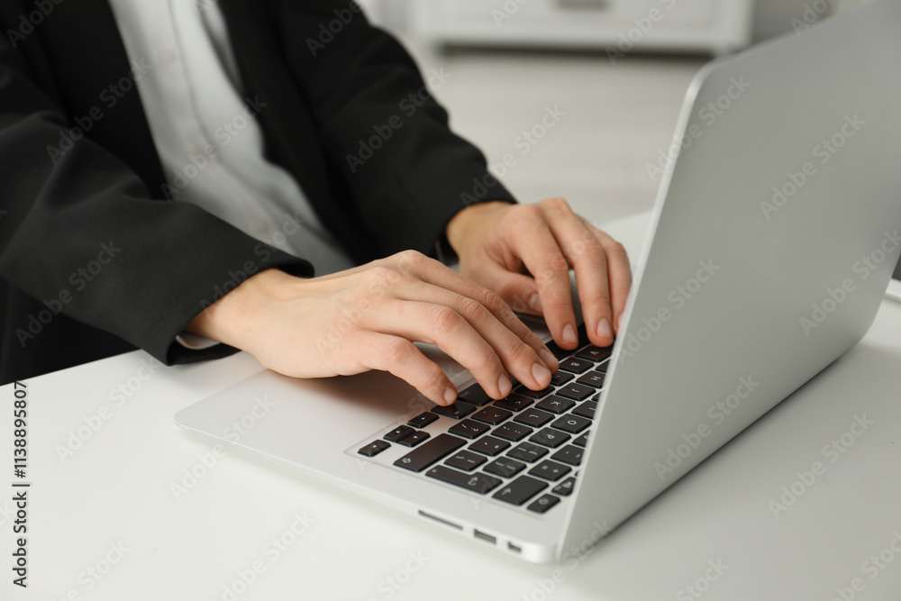 Businesswoman using laptop at white table indoors, closeup. Modern technology Businesswoman using laptop at white table indoors, closeup. Modern technology