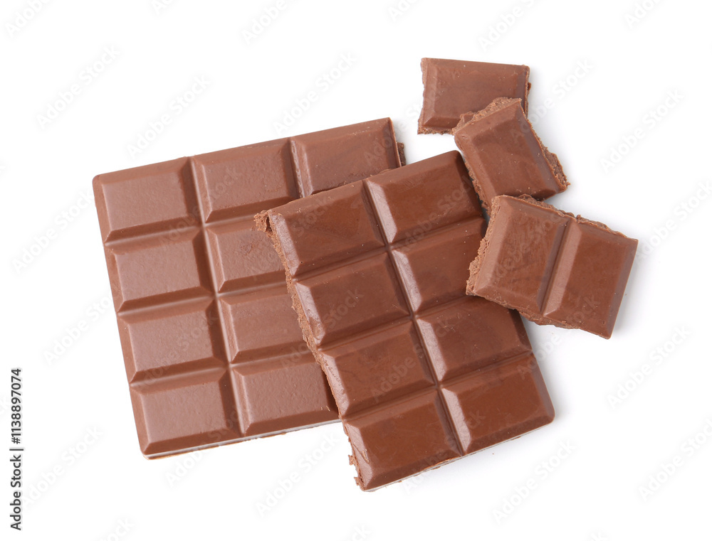 Pieces of delicious milk chocolate isolated on white, top view Pieces of delicious milk chocolate isolated on white, top view