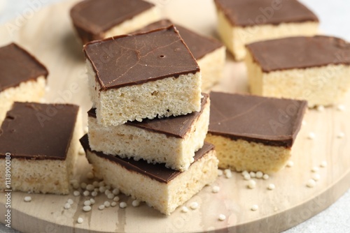 Delicious puffed rice bars on table, closeup