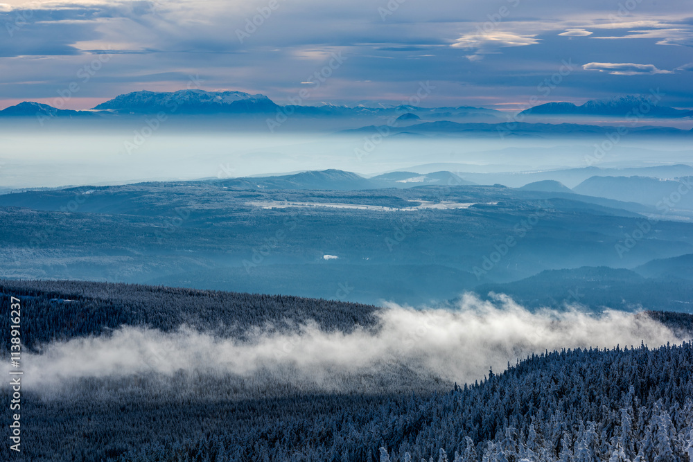 View from the Hargita mountains towards the Eastern Carpathians at sunset, Romania. View from the Hargita mountains towards the Eastern Carpathians at sunset, Romania.