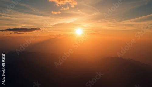 sunset with a mountain in the background