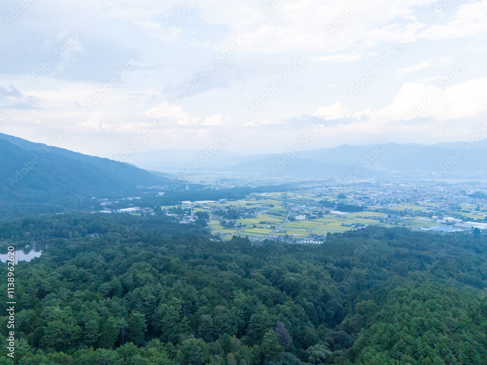 Obraz premium Aerial photo overlooking the city from the top of a mountain in Komagane City, Nagano Prefecture, Japan
