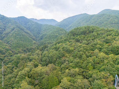 Aerial photo overlooking the city from the top of a mountain in Komagane City, Nagano Prefecture, Japan photo