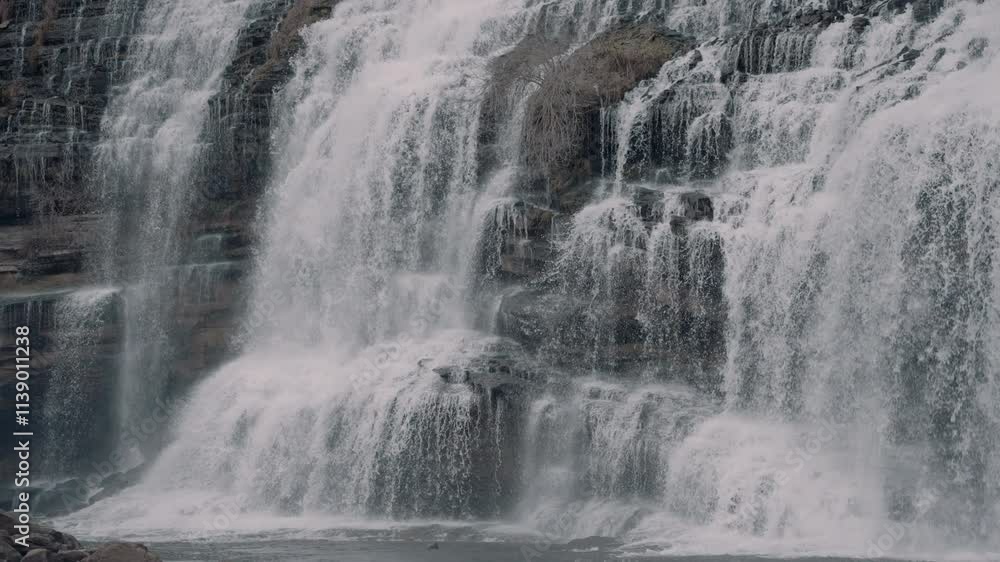 Large waterfall cascading down a cliff in the hills of Tennessee during the winter Large waterfall cascading down a cliff in the hills of Tennessee during the winter