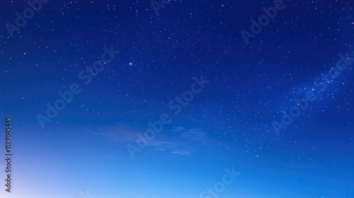 Wide-angle view of a serene starry sky with a blue gradient background, captured at night with bright stars and detailed clarity, evoking a calm and tranquil atmosphere.