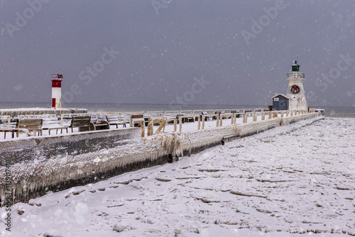 Lighthouse s on a winter snowy day on a frozen snow-covered lake Erie, Ontario Canada, beautiful winter landscape photo