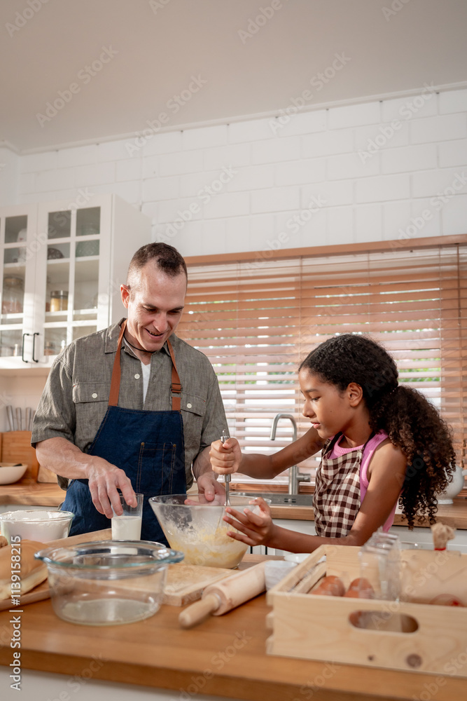 Caucasian senior father baking bakery with adopted daughter in house Caucasian senior father baking bakery with adopted daughter in house