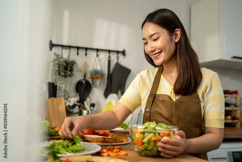 Asian young woman cooking healthy foods in kitchen in morning at home. Asian young woman cooking healthy foods in kitchen in morning at home.