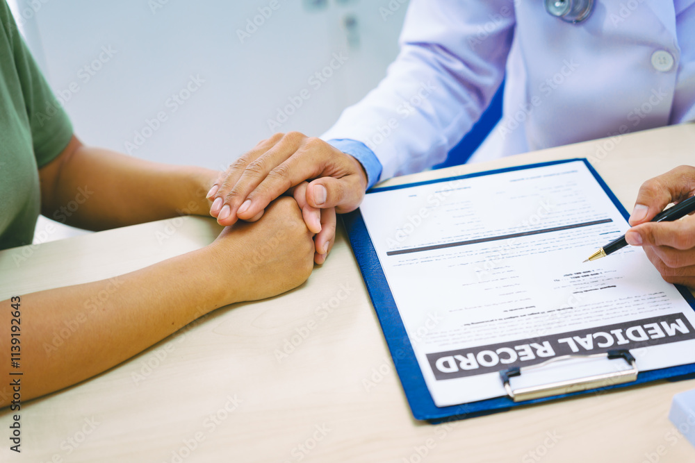 A woman with heart disease visits a doctor at the table in a hospital. The doctor explains conditions like coronary artery disease, arrhythmia,and heart valve disease,providing advice and medication A woman with heart disease visits a doctor at the table in a hospital. The doctor explains conditions like coronary artery disease, arrhythmia,and heart valve disease,providing advice and medication